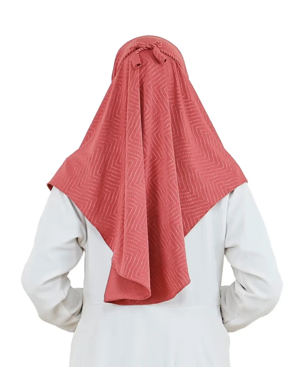 A woman models a Dusty Rose Chevron Hijab, facing forward and highlighting the subtle chevron print and the ready-to-wear style of the garment.